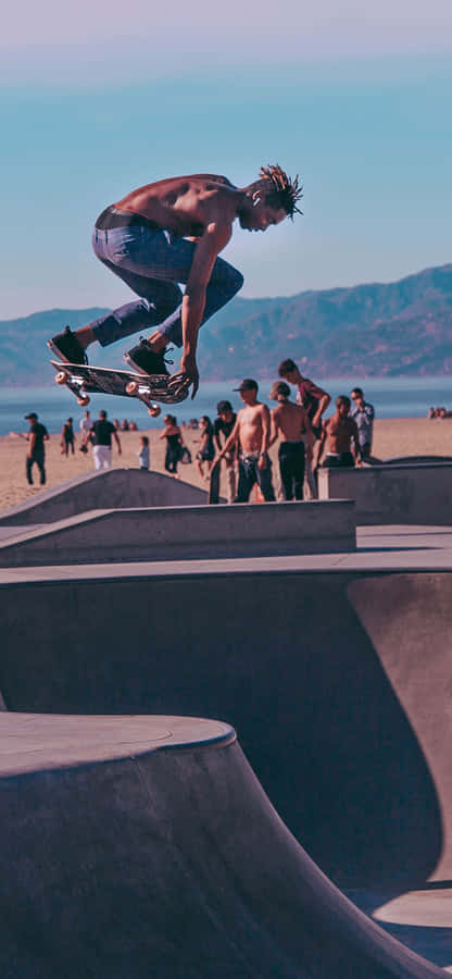 Skateboarder Mid Air Trick Wallpaper