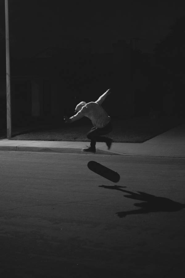 Skater Boy In The Dark Wallpaper