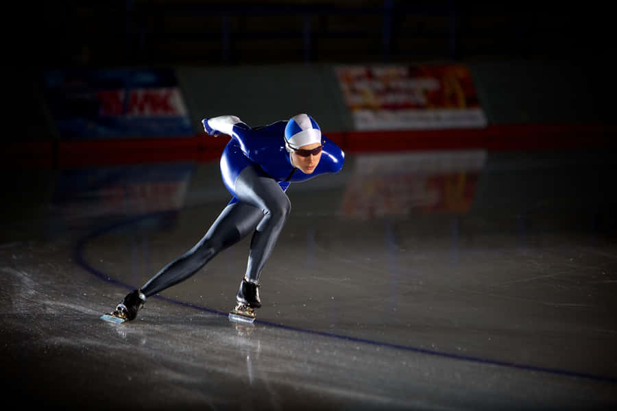 Skater Grinding A Rail On His Skateboard Wallpaper
