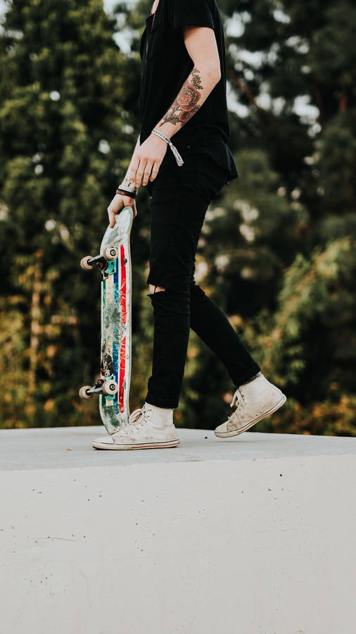 Skater With Tattoo Skateboard Iphone Wallpaper