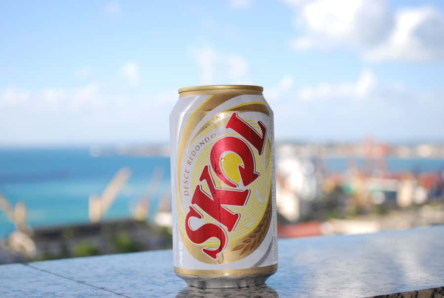 Skol Beer Can Overlooking Cityscape Wallpaper