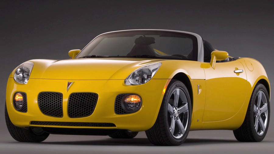 Sleek 2007 Pontiac Solstice Gxp Parked Outdoors Wallpaper