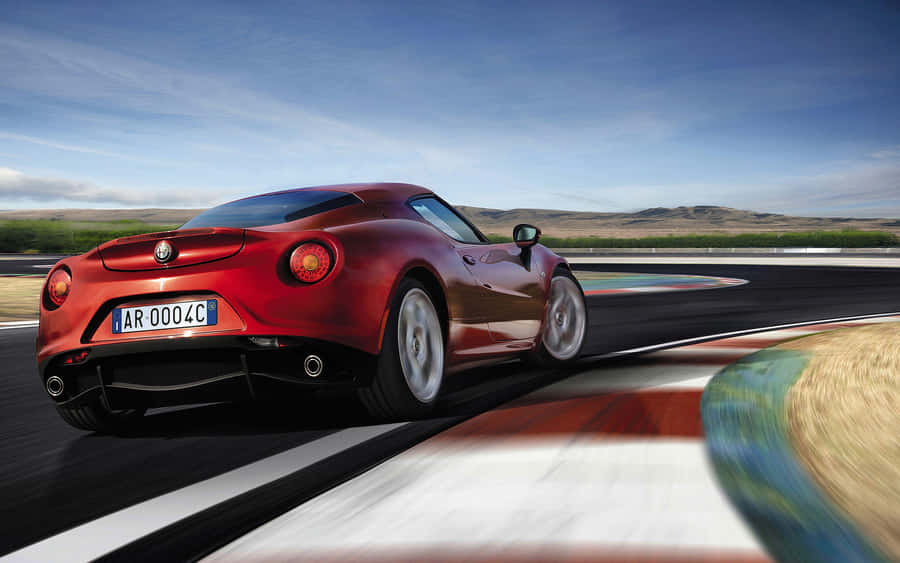 Sleek Alfa Romeo 4c Sports Car In Action Wallpaper