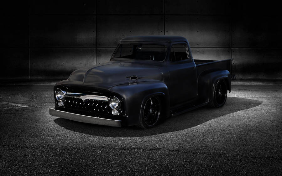 Sleek Black Dropped Truck In All Its Glory Wallpaper