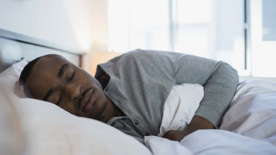 Sleeping Man With Gray Sweatshirt Wallpaper