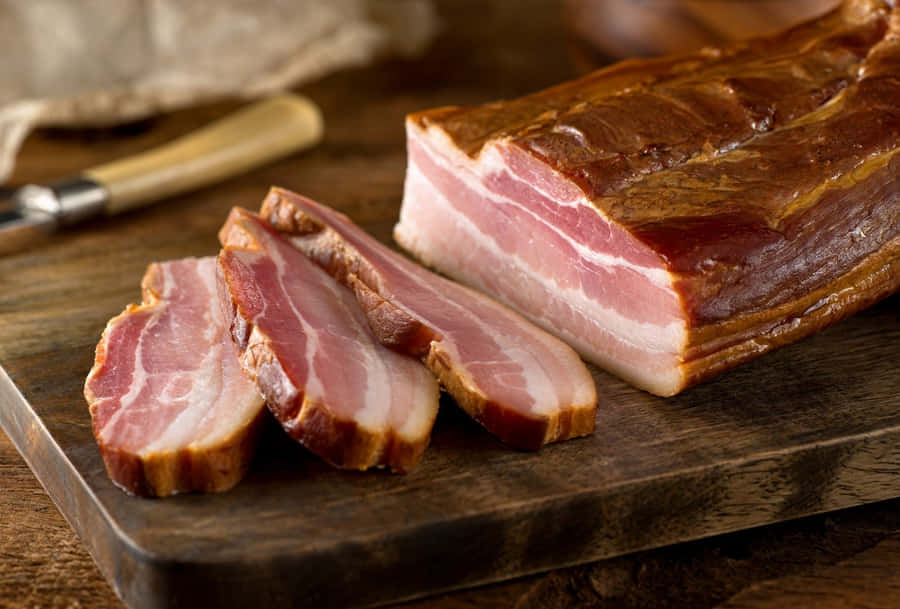 Sliced Smoked Baconon Cutting Board Wallpaper