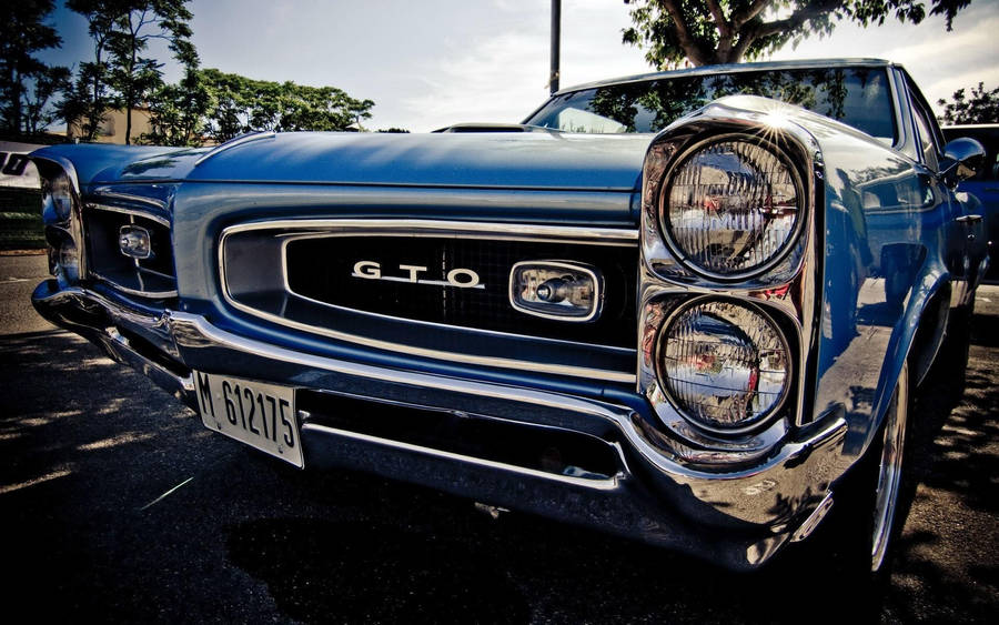 Slick Front Bumper Of A Classic Pontiac Gto Wallpaper