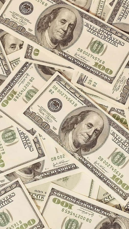 Slightly Brown 100 Dollar Bill Pile For Phone Wallpaper