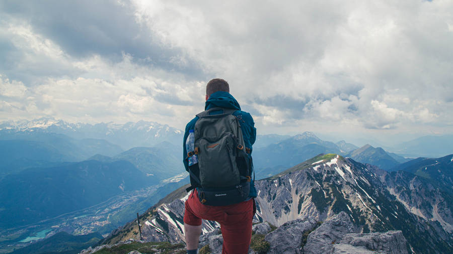 Slovenia Mountain Climber With Backpack Wallpaper