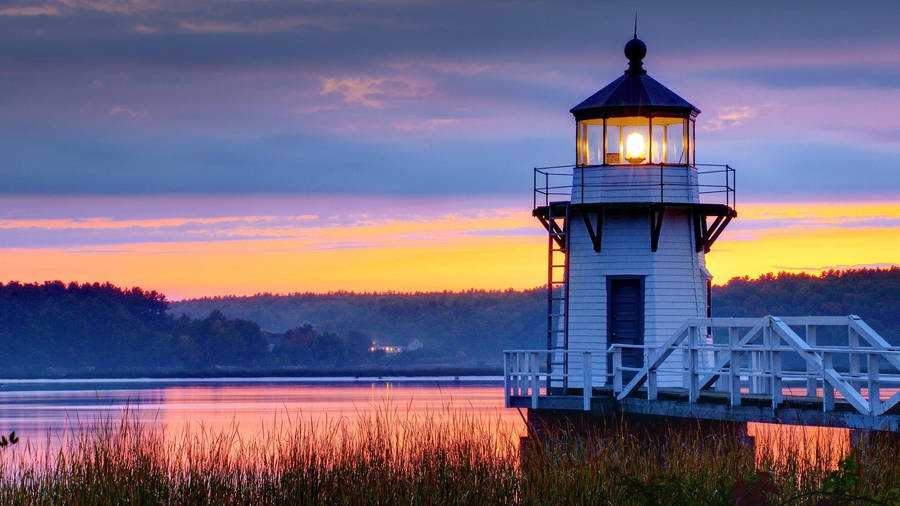 Small Sunset Lighthouse Wallpaper