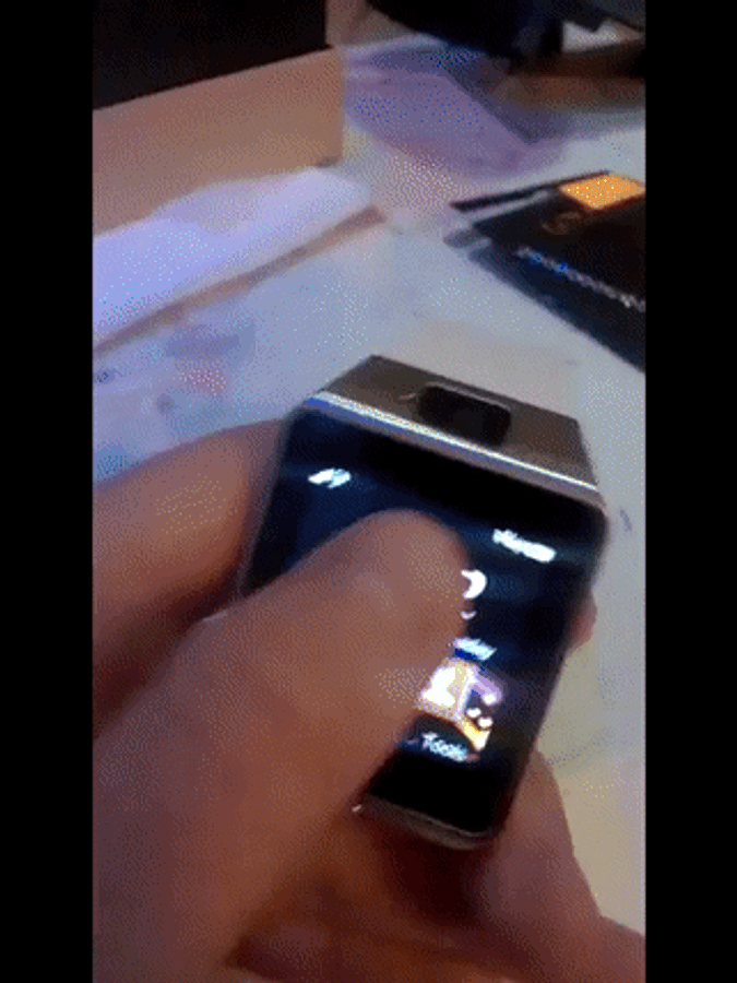 Smartwatch On A Desk With A Smartphone Wallpaper