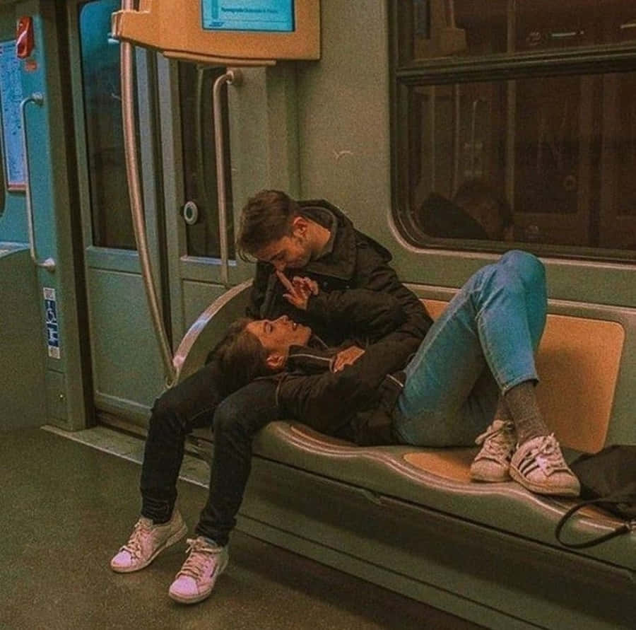 Smiling Couple Enjoying A Sweet Moment Together Wallpaper