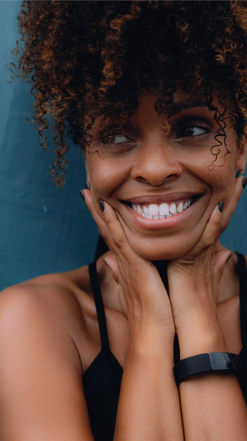 Smiling Girl With Curly Hair Wallpaper