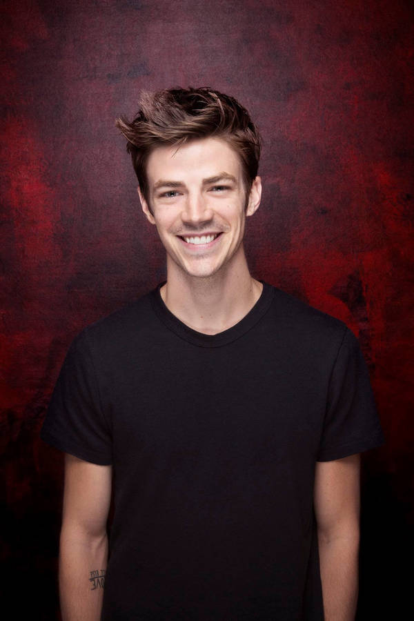 Smiling Grant Gustin Wallpaper