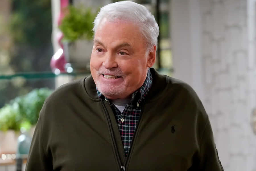 Smiling Manin Casual Attire Wallpaper