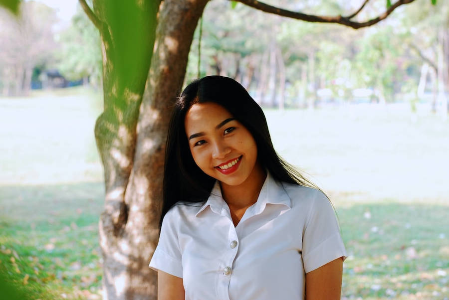 Smiling Thailand Woman In White Uniform Wallpaper