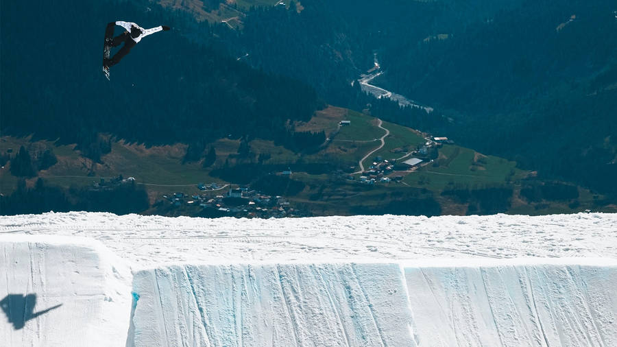 Snowboarding Overlooking Mountains Wallpaper