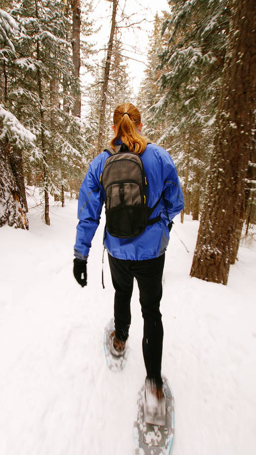 Snowshoeing In The Snow Mountain Wallpaper