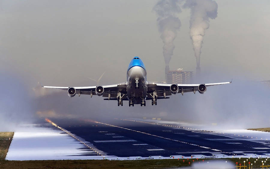 Snowy Airport Runway With Klm Aircraft Wallpaper