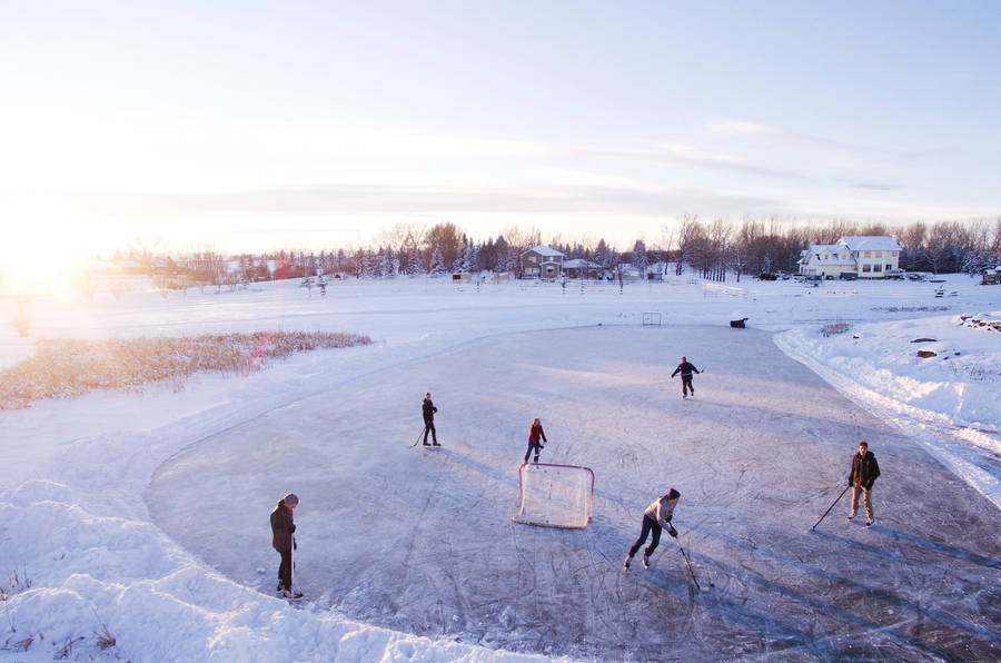 Snowy Outdoor Ice Hockey Wallpaper