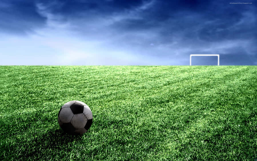 Soccer Ball And Goal Post On Football Field Wallpaper