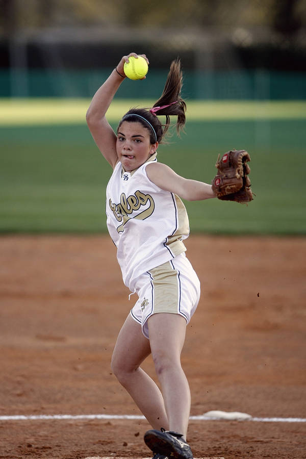 Softball Pitcher Throwing The Ball Wallpaper