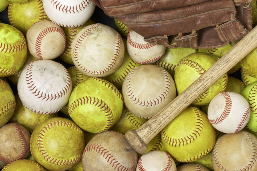 Softball Stock Pile With Bat Wallpaper