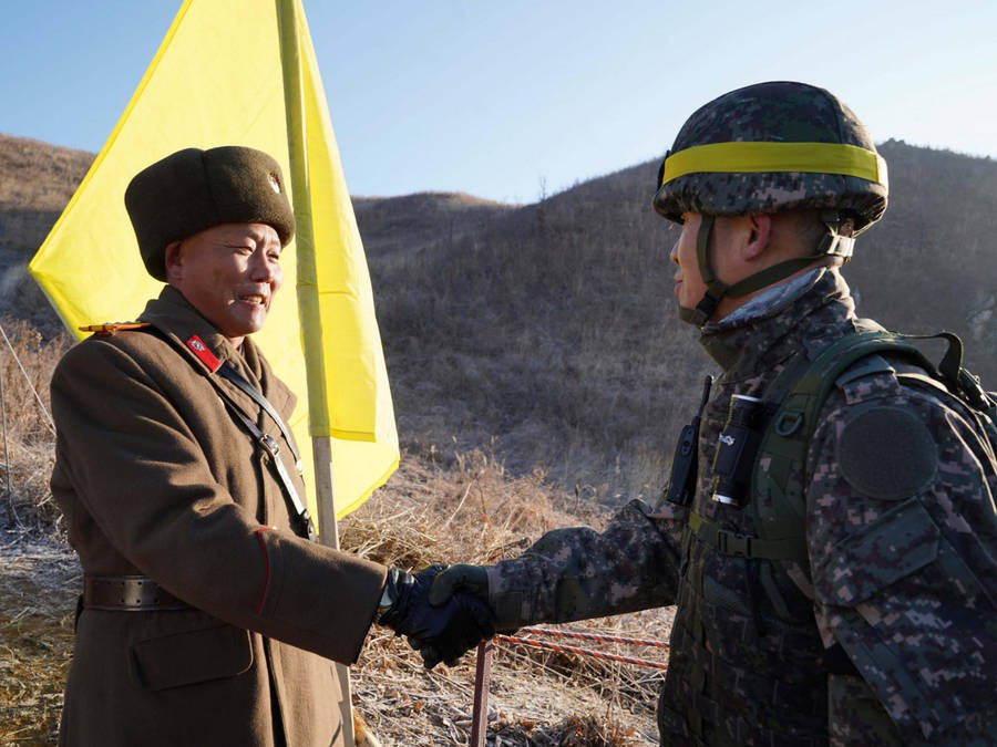 South And North Korea Soldiers Handshake Wallpaper