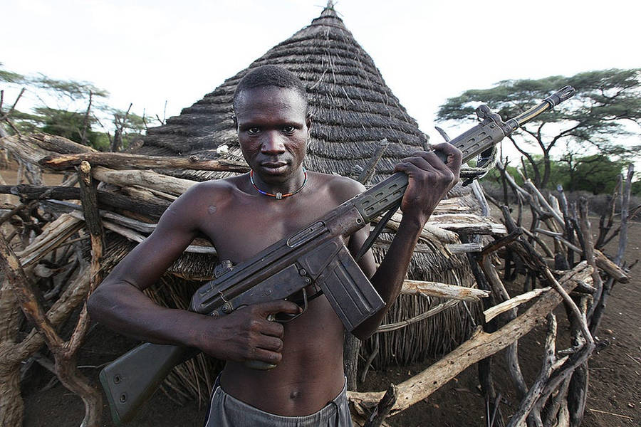 South Sudan Man Holding Assault Rifle Wallpaper