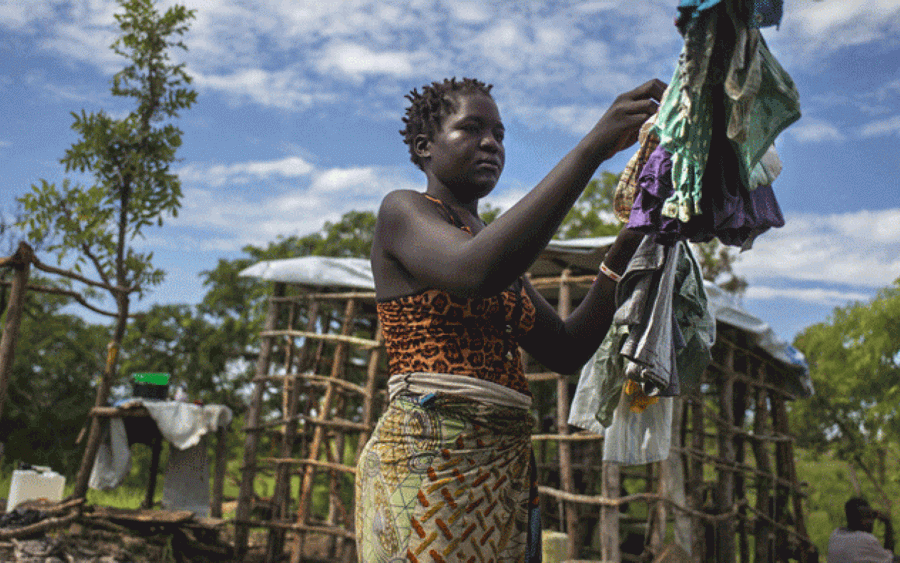 South Sudan Woman Hanging Clothes Wallpaper