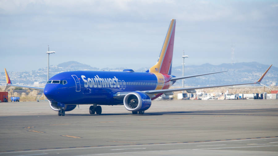 Southwest Airlines Blue Airplane On Runway Wallpaper