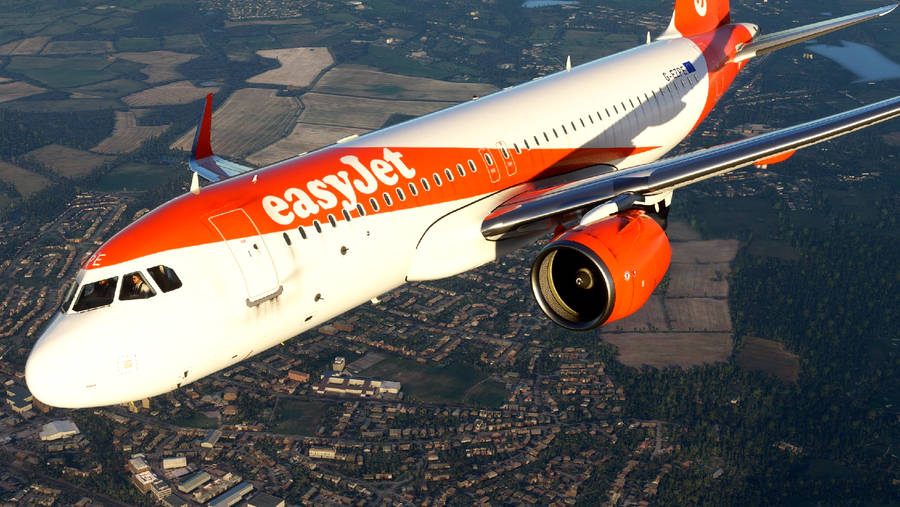 Spectacular Aerial View Of An Easyjet Flight Over A Vibrant City Wallpaper