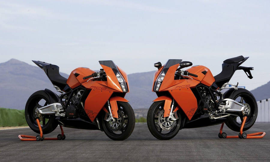 Spectacular Pair Of Orange And Black Ktm Bikes Wallpaper