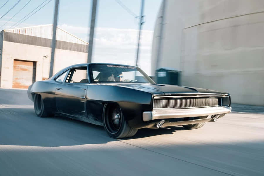 Speeding_ Muscle_ Car_ Action Wallpaper