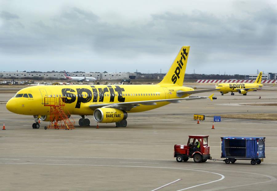 Spirit Airlines Plane And Airport Tractor Wallpaper