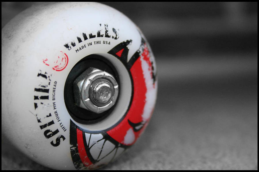 Spitfire Logo Face On Skateboard Wheel Wallpaper