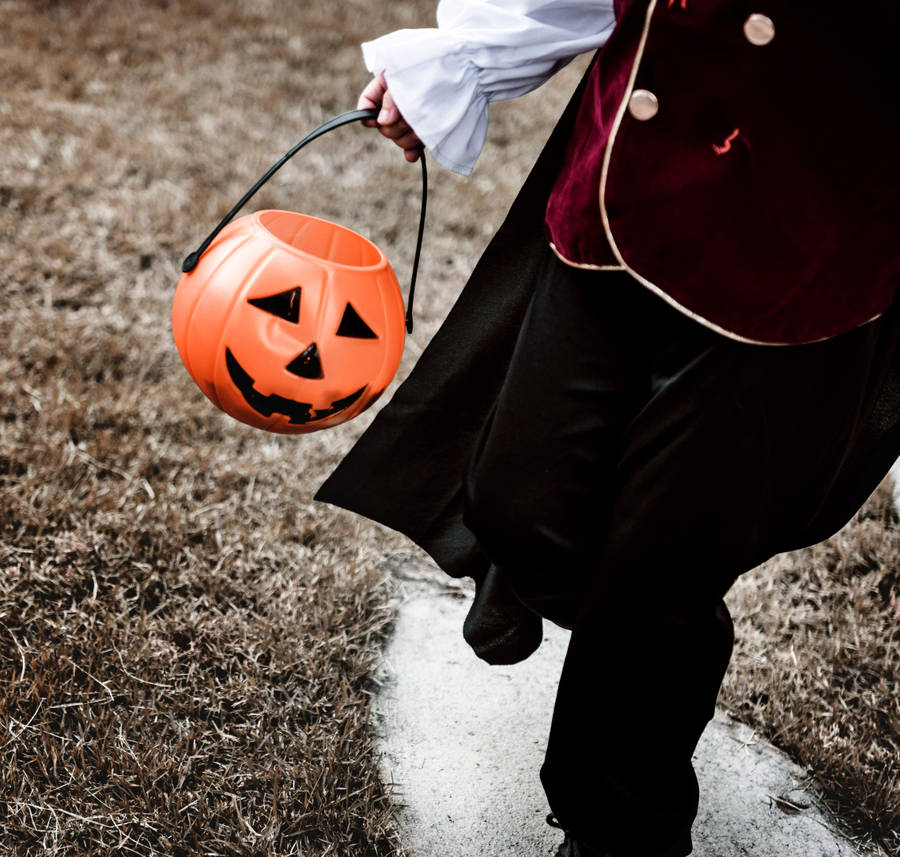 Spooky Yet Cute Halloween Candy Basket Wallpaper