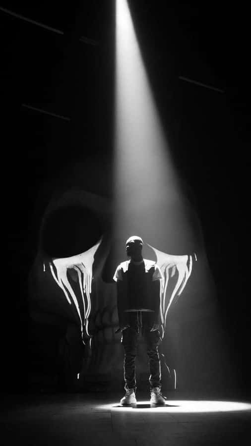 Spotlighted_ Performer_in_ Shadows Wallpaper