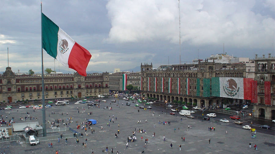 Standing Mexico Flag In The City Wallpaper