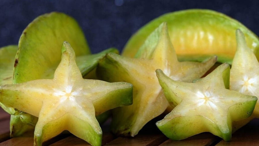 Star Fruits On The Wooden Table Wallpaper