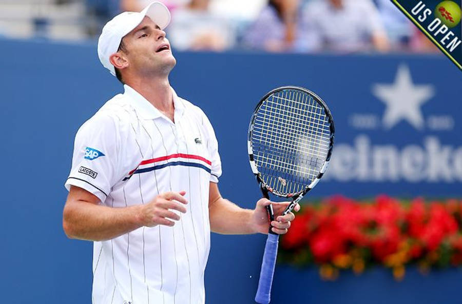 Star Tennis Player Andy Roddick In Full Swing Wallpaper