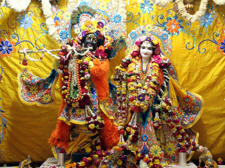 Statues Of Krishna And Radha In Iskcon Temple Wallpaper