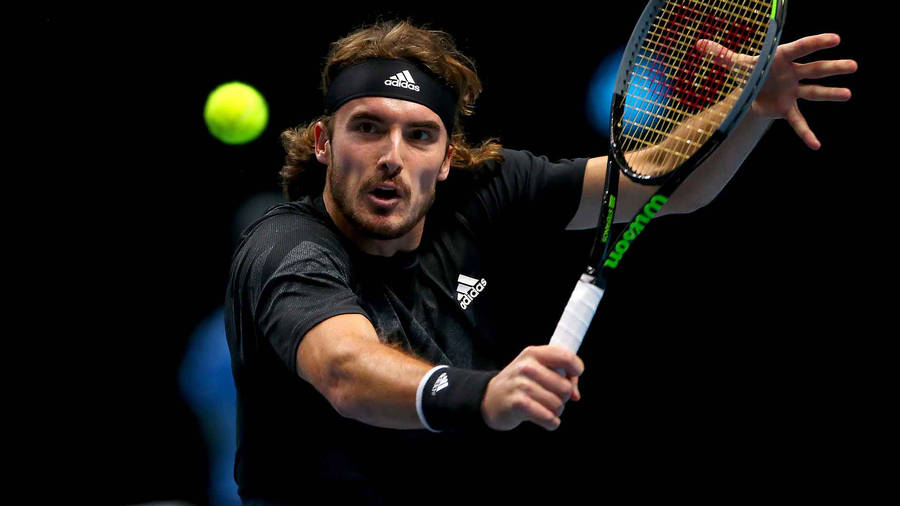 Stefanos Tsitsipas Perfecting His Backhand Stroke Wallpaper