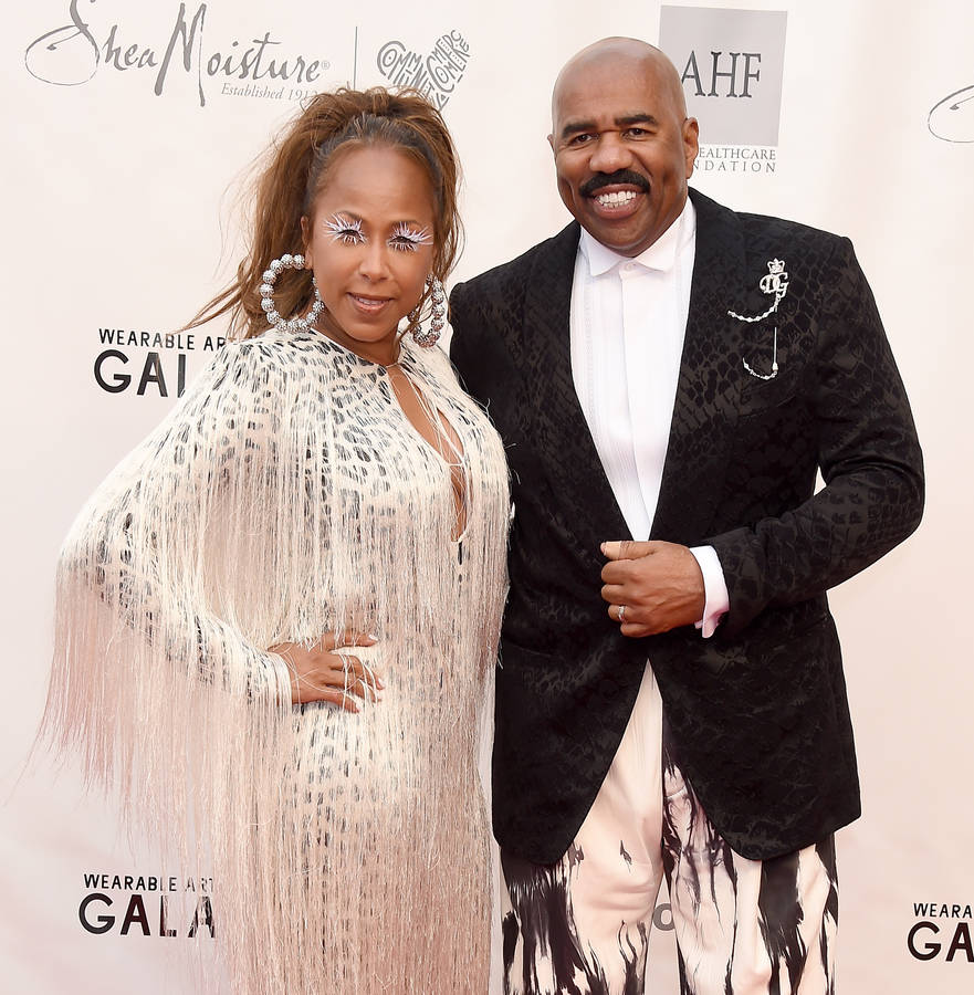 Steve Harvey Posing With His Wife Wallpaper