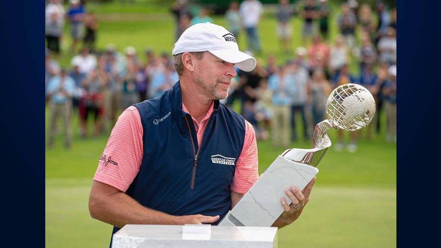 Steve Stricker Admiring A Trophy Wallpaper