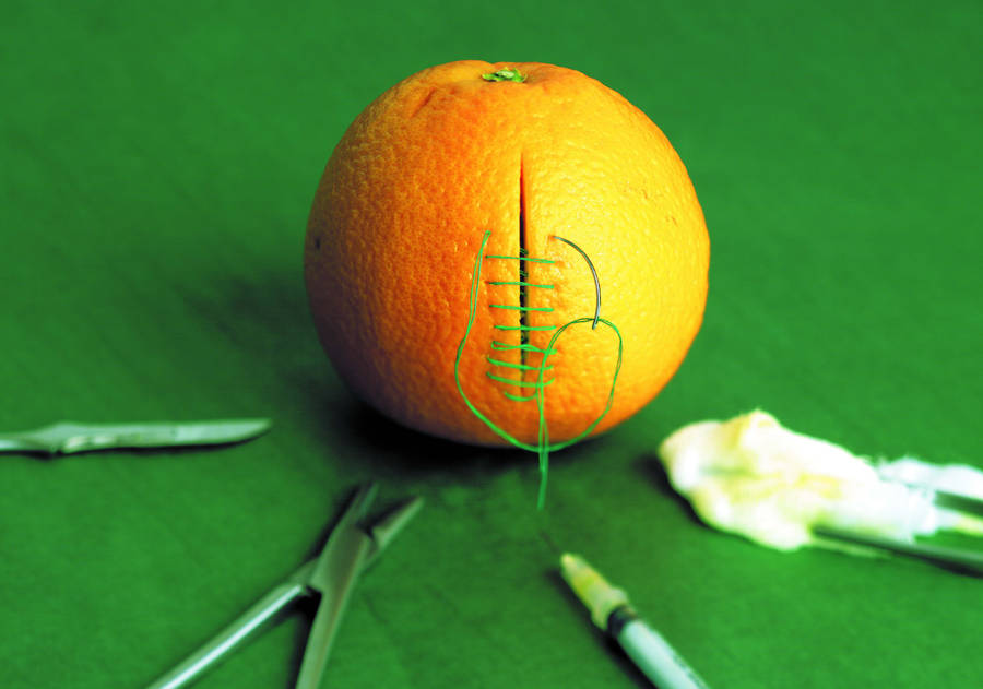 Stitches On Orange Photography Wallpaper