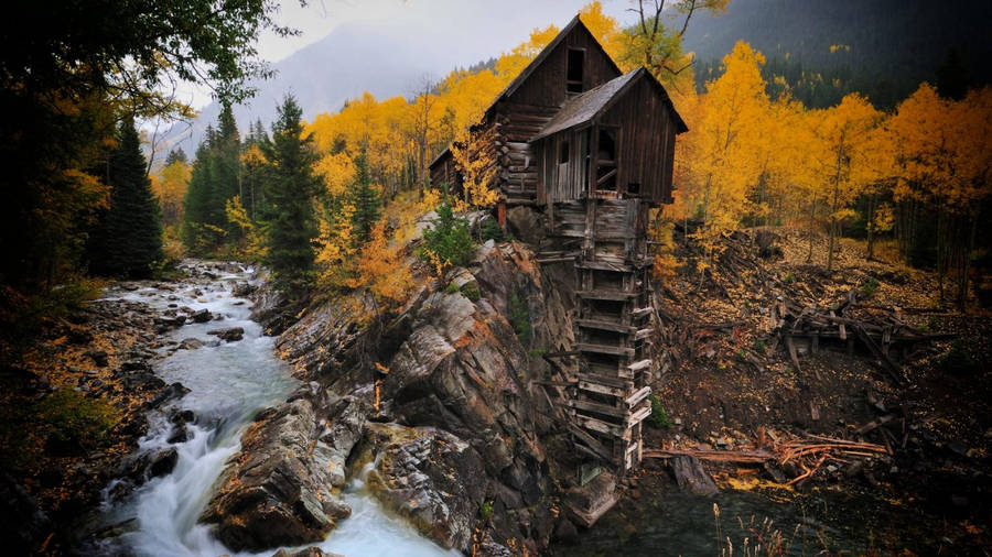 Strange Wooden House On Cliff Wallpaper