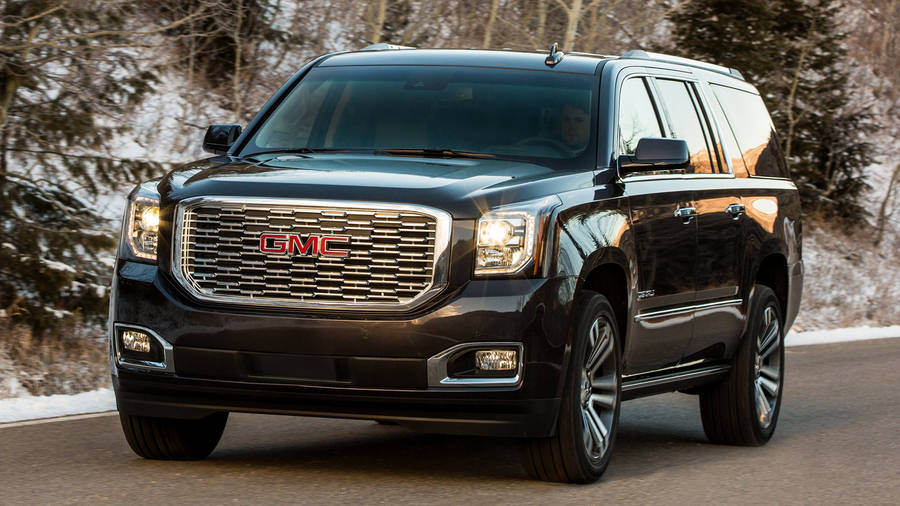 Striking Gmc Yukon Cruising The Open Road Wallpaper