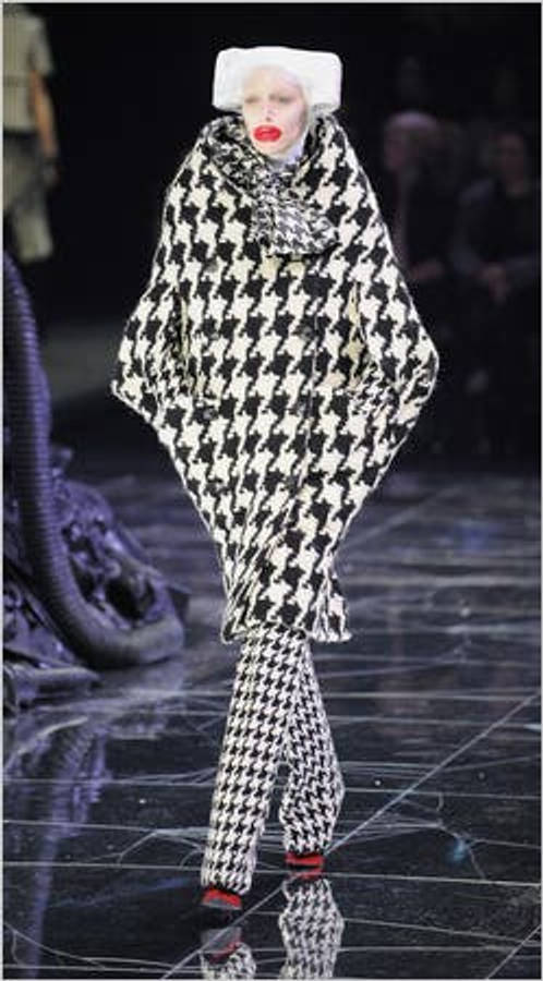 Striking Presentation Of Alexander Mcqueen's Checkered Outfit From His Latest Collection Wallpaper