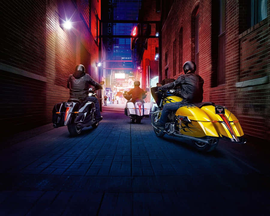 Striking Victory Motorcycle In Nighttime Cityscape Wallpaper